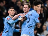 Manchester City's Nico O'Reilly, Kevin De Bruyne and Phil Foden celebrate on March 1, 2025