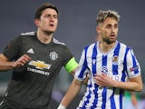 Manchester United's Harry Maguire in action with Real Sociedad's Adnan Januzaj on February 18, 2021