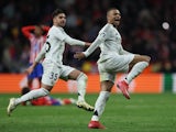 Real Madrid players Kylian Mbappe and Raul Asencio celebrate on March 12, 2025