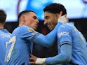 Manchester City's Phil Foden and Omar Marmoush celebrate on February 15, 2025